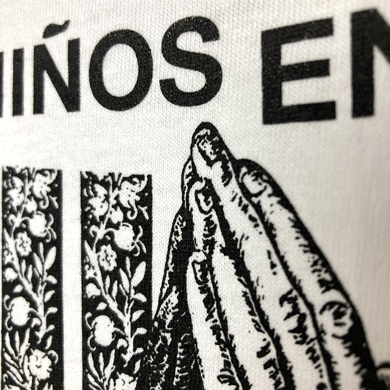 Detail of the tearjerker screen printed DIY t-shirt featuring "Los Niños Del Parque" by Liaisons Dangereuses